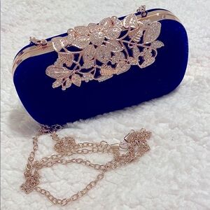 Elegant Blue Clutch with Gold Floral Accent